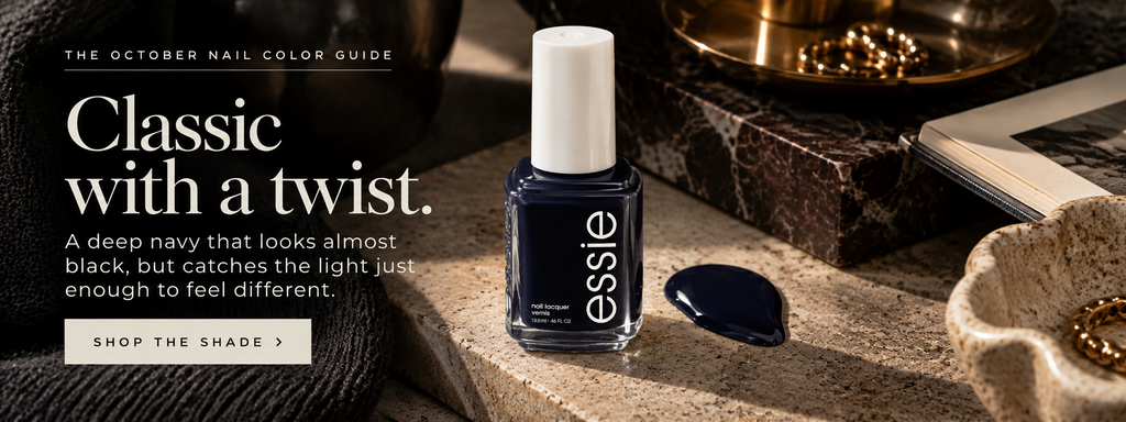 Essie After School Boy Blazer deep navy nail polish styled as a midnight blue manicure shade.