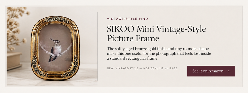 Small bronze-gold vintage-style picture frame with rounded corners and raised floral detailing.