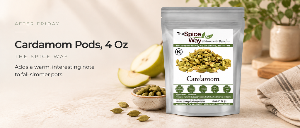 Whole green cardamom pods paired with pear in an editorial kitchen setting for aromatic fall simmer pot combinations.
