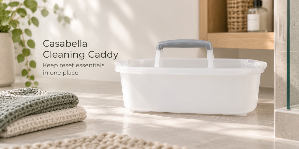 White Casabella cleaning caddy in a bright bathroom ready for a quick cleaning reset.